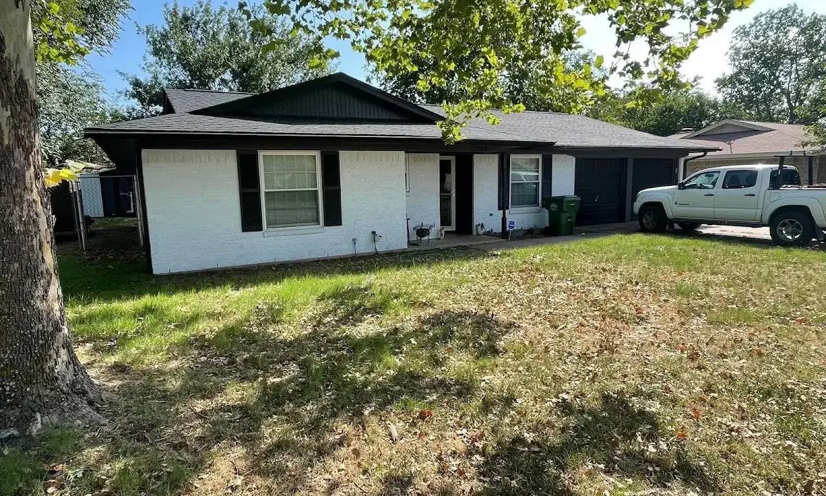 Professional roofing crew working on a residential roof in Saratoga